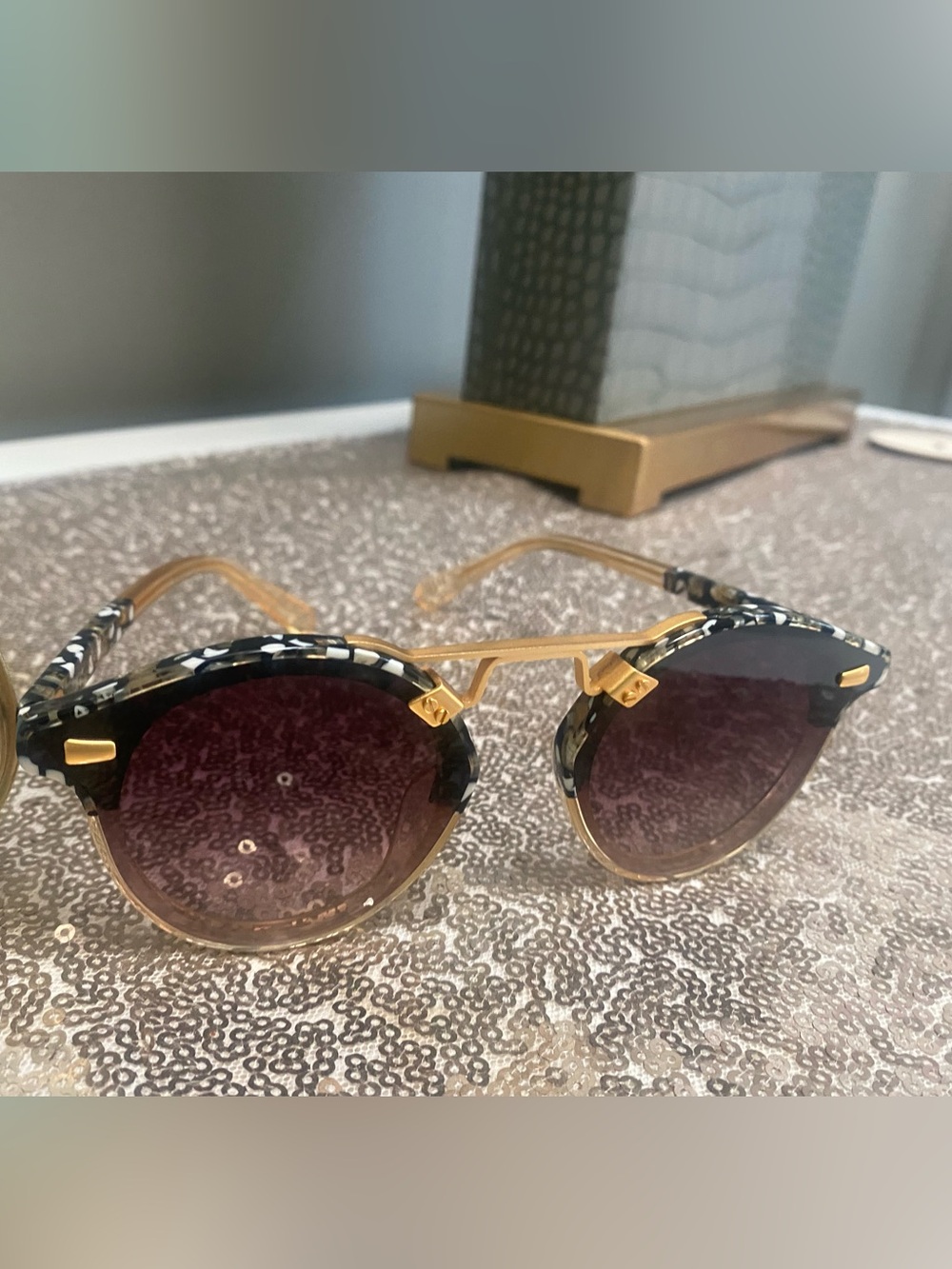 Gold-Tone Round Sunglasses with Black Patterned Brow and Purple Gradient Lenses
